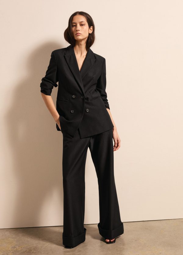 Pantalone flare fit con risvolti